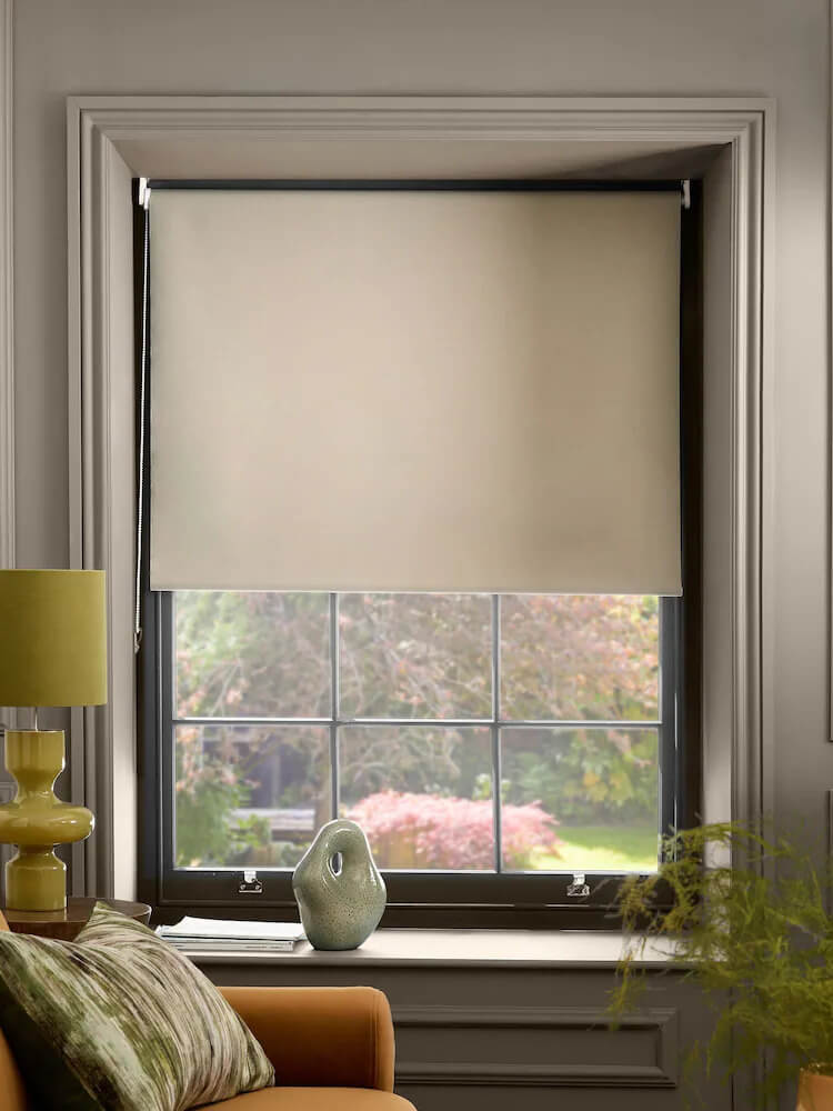 Blackout roller blinds in a modern bedroom